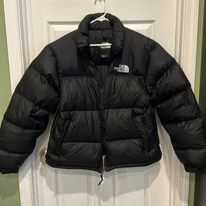 The North Face Men’s puffer jacket. With hidden hood and zippered inside pocket.